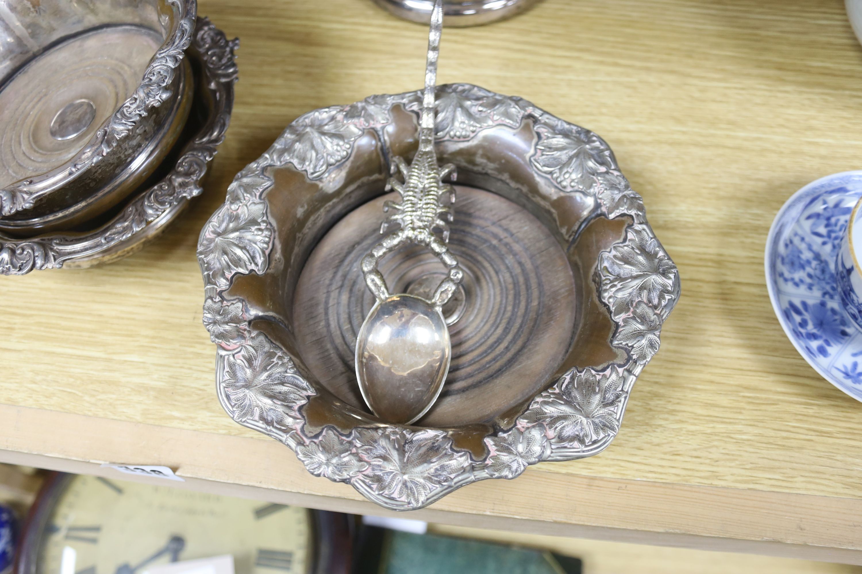 A pair of late Victorian pierced silver plated magnum coasters, height 12cm, two other pairs of plated wine coasters, one other and two spoons.